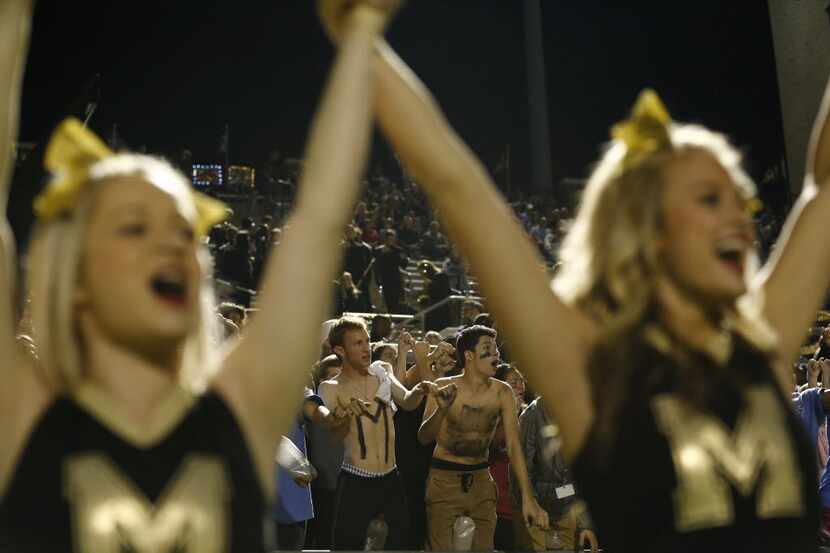 Mansfield cheers for a kickoff against  Cedar Hill during their game at Vernon Newsom...