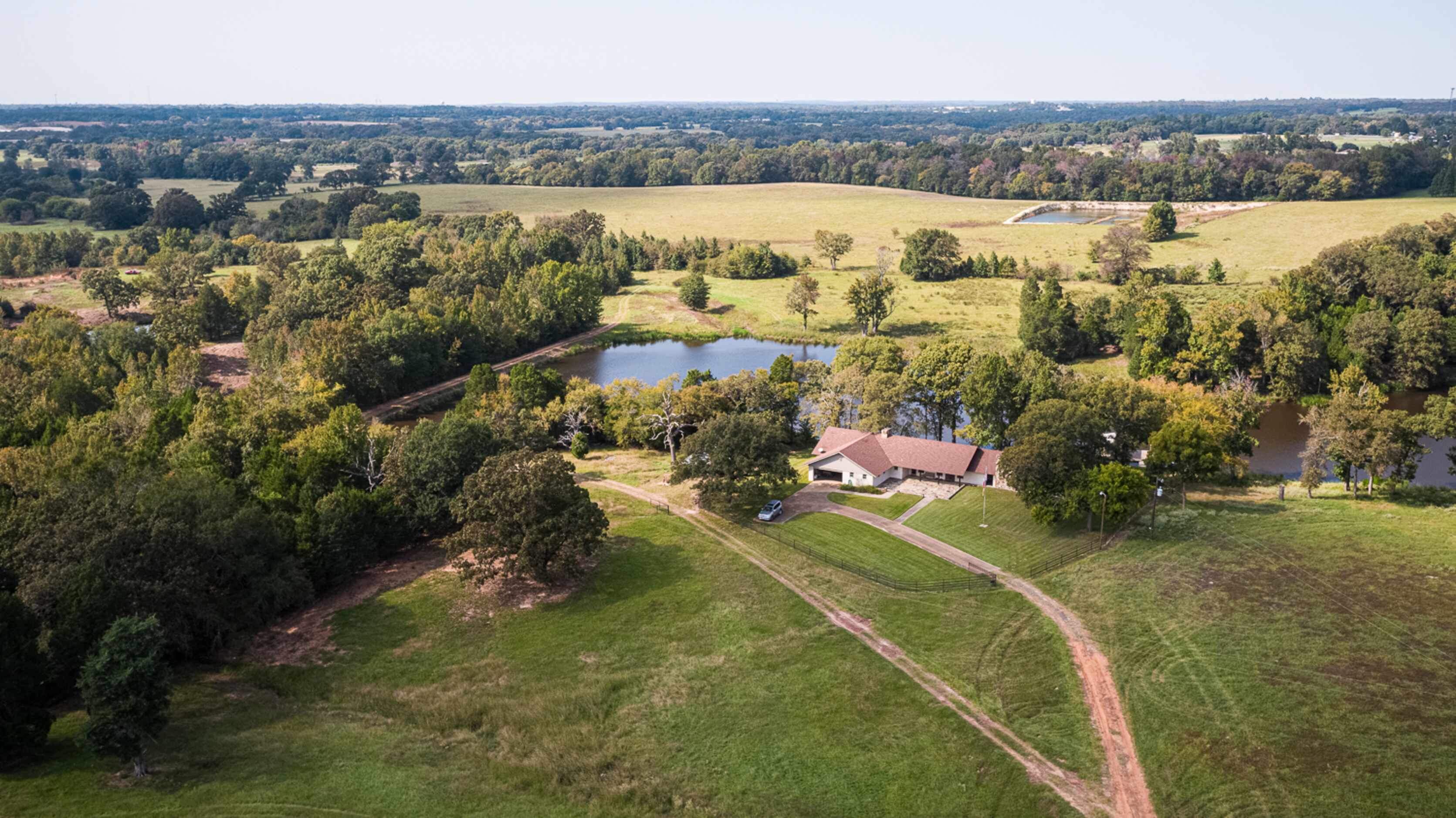 With a 4,000-square-foot fishing cabin, most of the acreage is a blank canvas with potential...