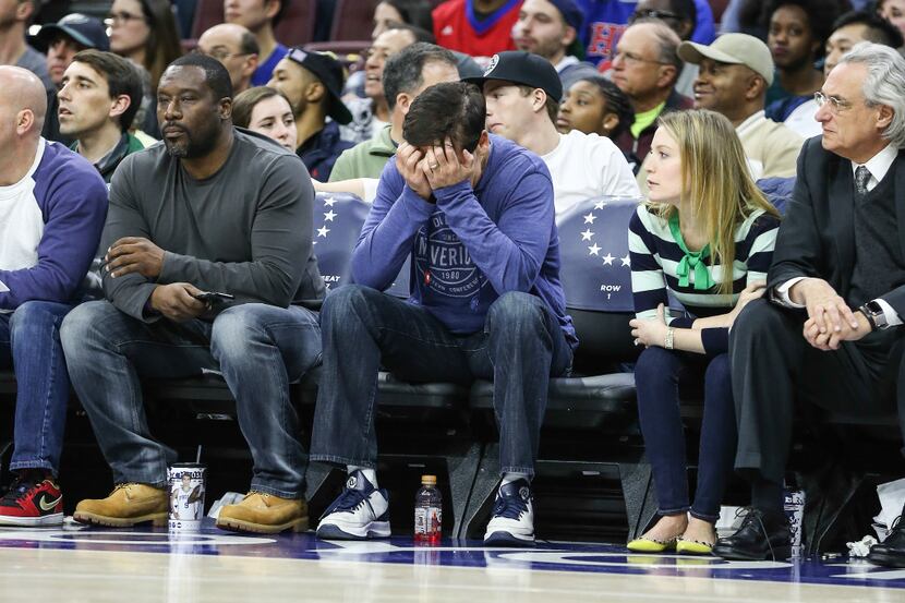 Dallas Mavericks owner Mark Cuban reacts to a missed basket by the Mavericks against the...