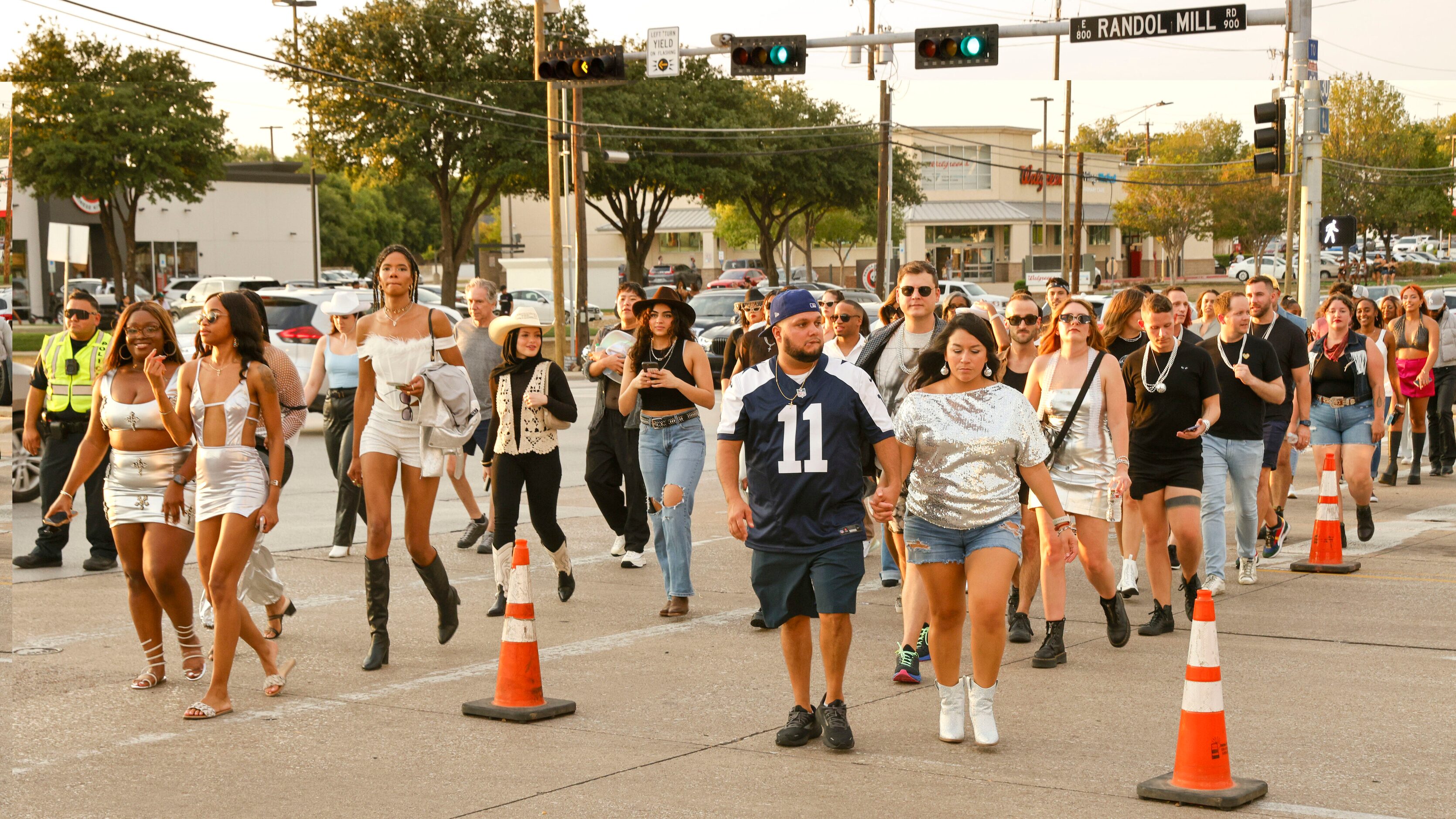 Concertgoers cross Randol Mill Road before Beyoncé’s Renaissance World Tour concert at AT&T...