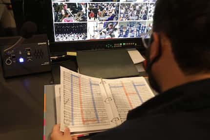 Andrew Alden directs the video crew as the Dallas Symphony Orchestra performs at the...