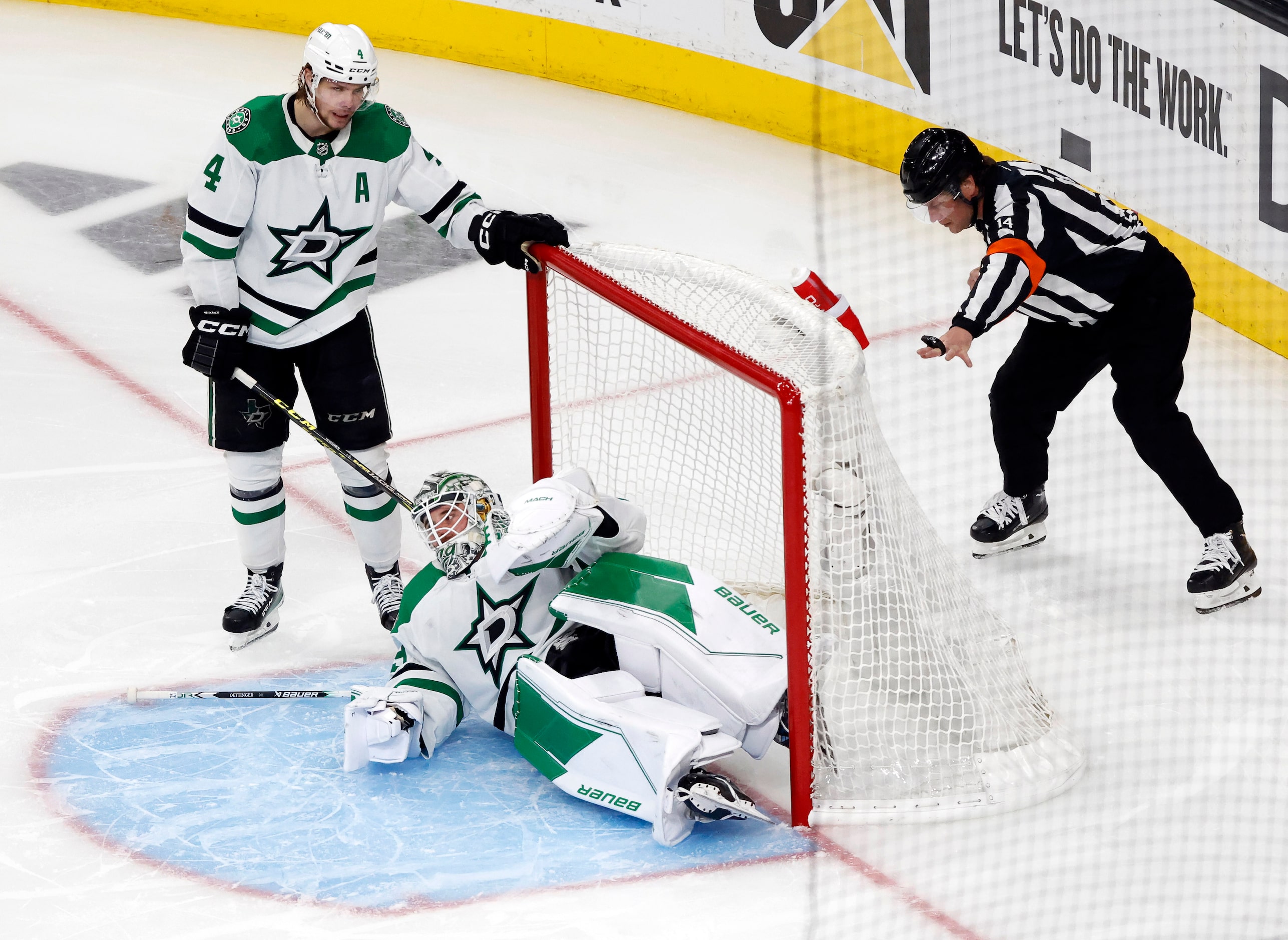 Dallas Stars defenseman Miro Heiskanen (4) reacts after goaltender Jake Oettinger (29)...