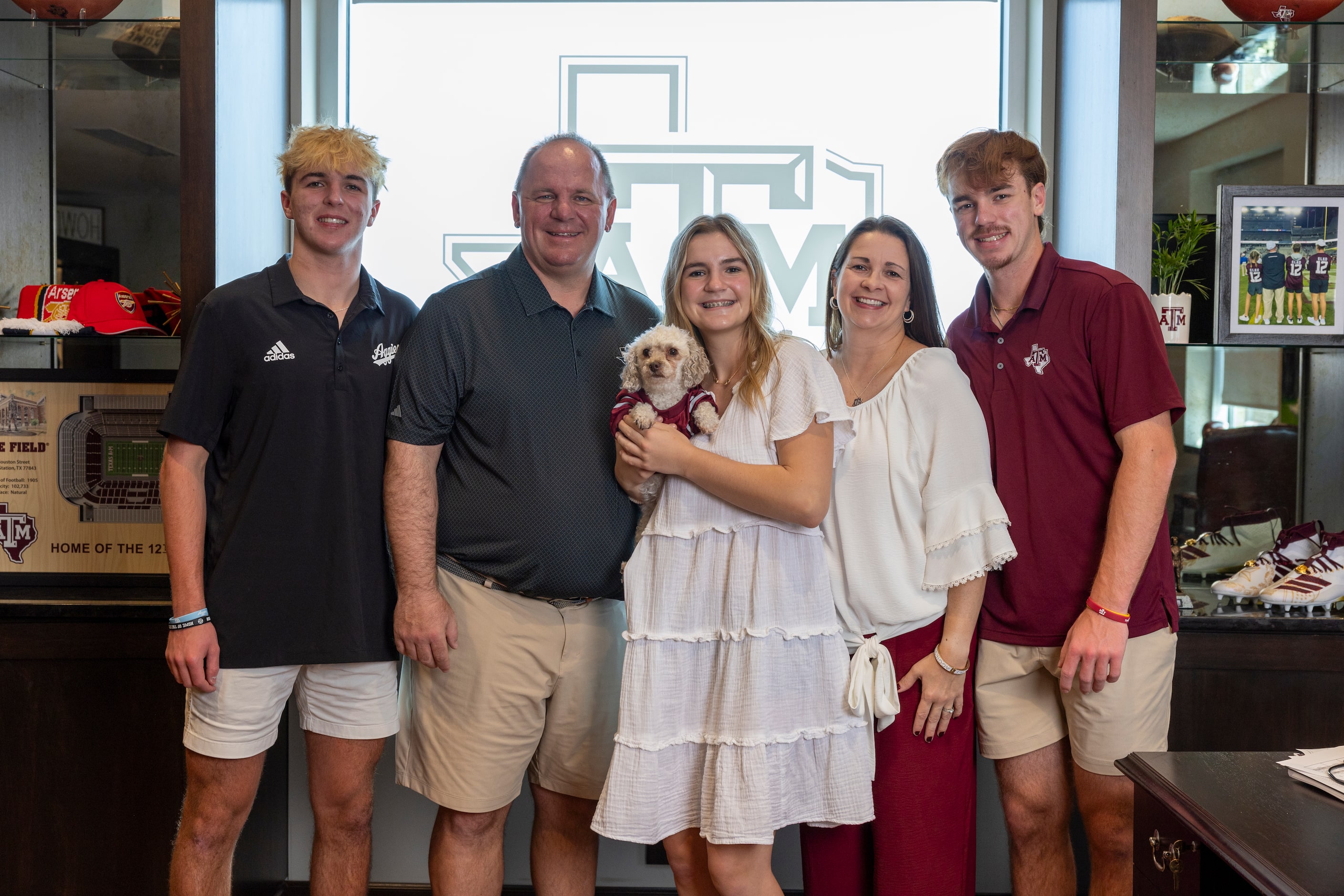 Texas A&M head coach Mike Elko (left center) poses for a family photo with his son Andrew...