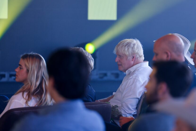 Former British Prime Minister Boris Johnson listens to Gov. Greg Abbott at UP.Summit...