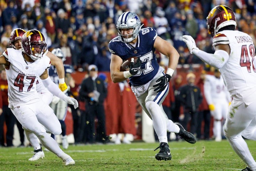 Dallas Cowboys tight end Jake Ferguson (87) runs after a catch as Washington Commanders...