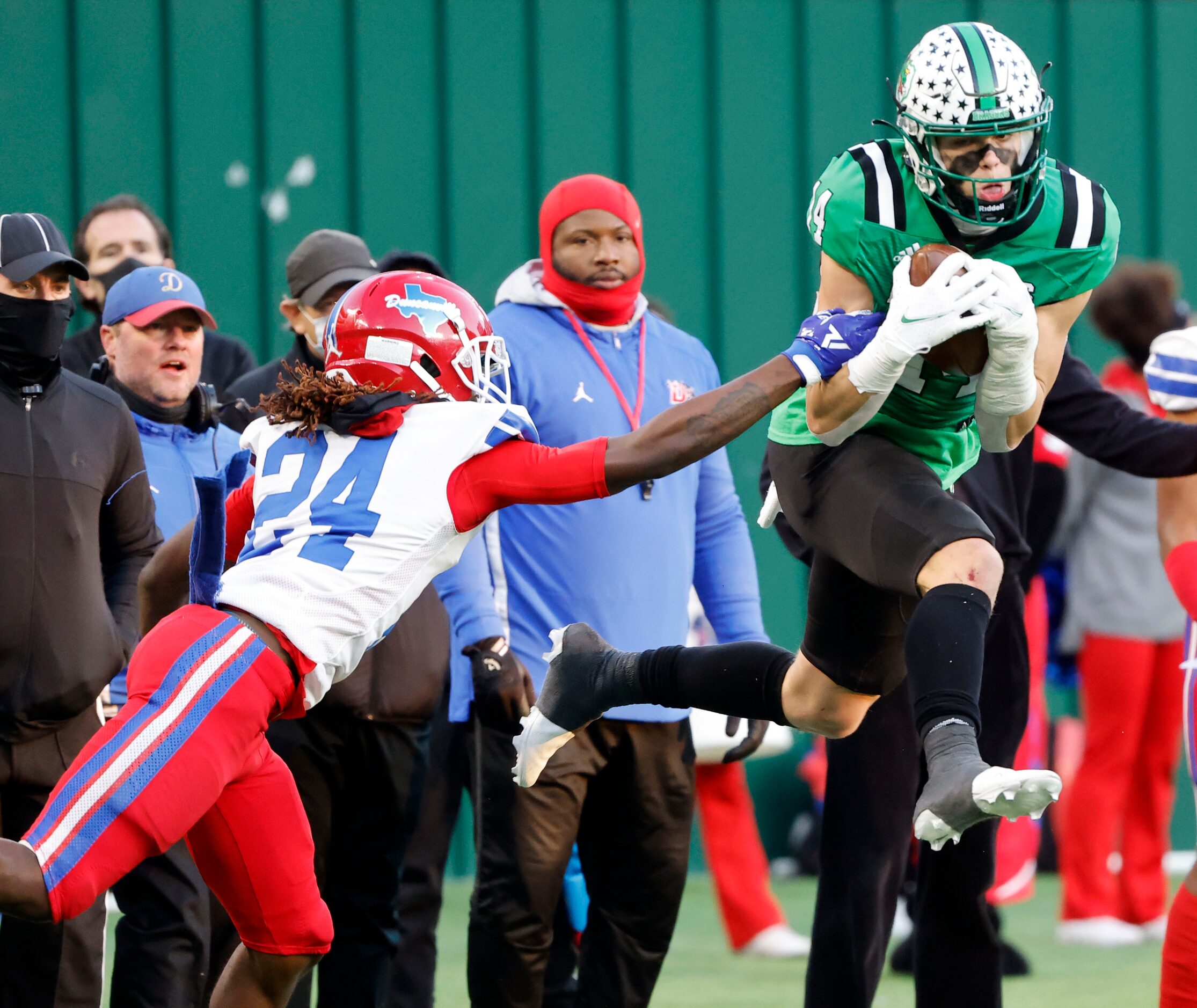 Southlakes Brady Boyd (14) makes a catch in front of Duncanville’s Deldrick Madison (24)...