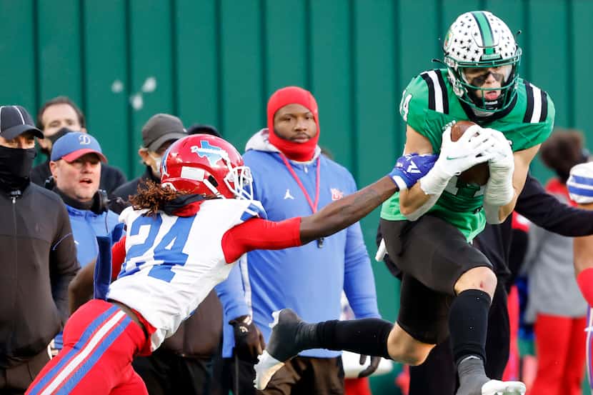 Southlakes Brady Boyd (14) makes a catch in front of Duncanville’s Deldrick Madison (24)...