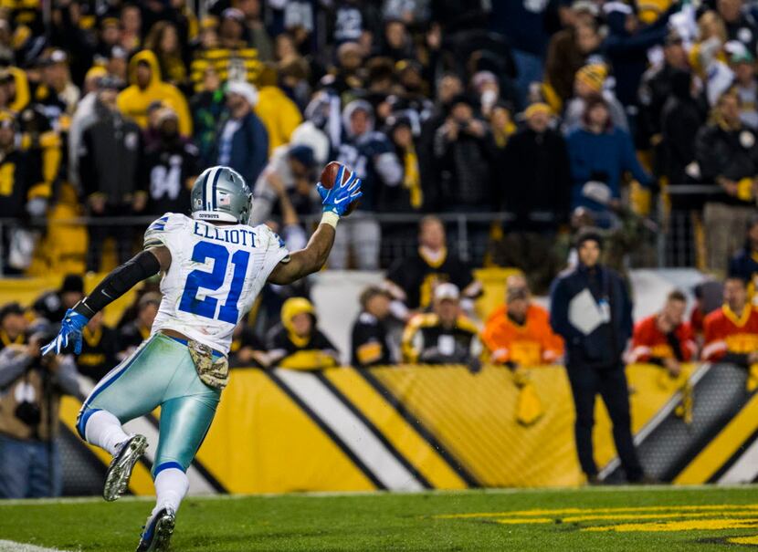 Dallas Cowboys running back Ezekiel Elliott (21) celebrates after running the ball to the...