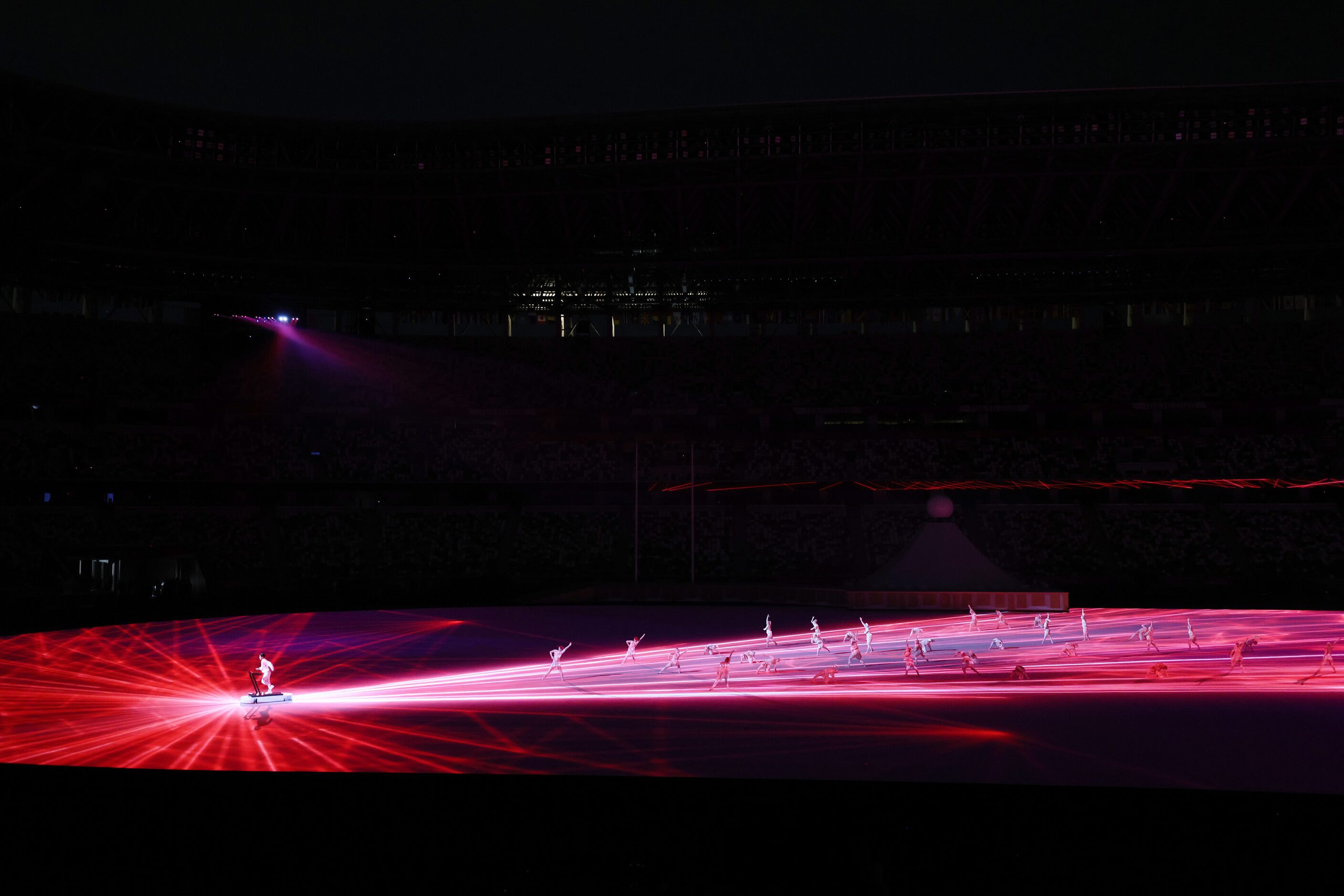 Entertainers perform during the opening ceremony for the postponed 2020 Tokyo Olympics at...