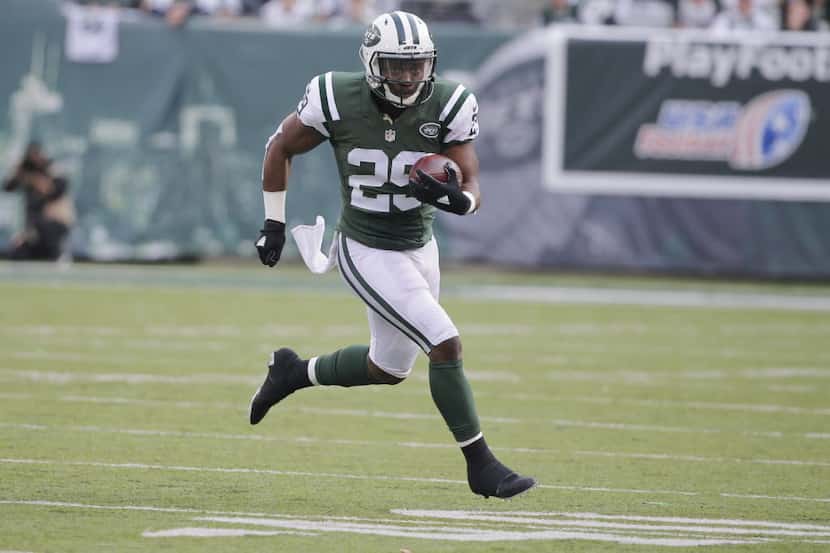 New York Jets running back Bilal Powell (29) rushes during the first half of an NFL football...