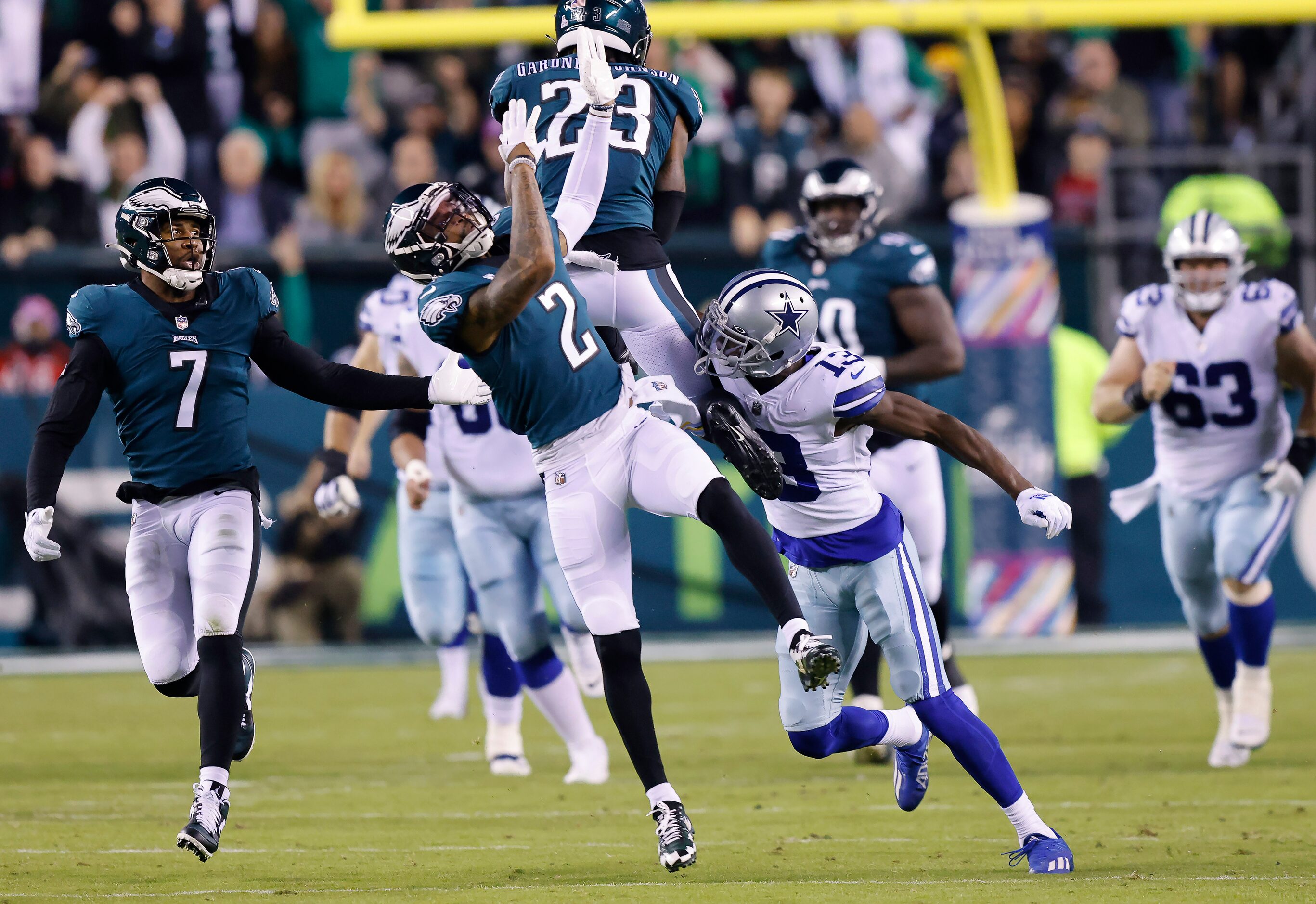 Dallas Cowboys wide receiver Michael Gallup (13) tries to tackle Philadelphia Eagles safety...