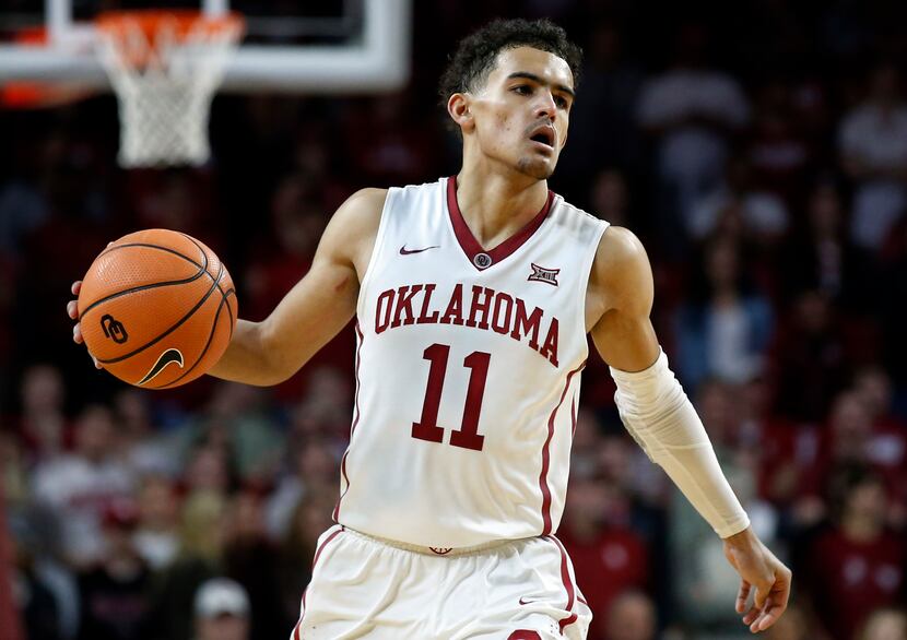 FILE - In this Feb. 17, 2018, file photo, Oklahoma guard Trae Young (11) brings the ball...