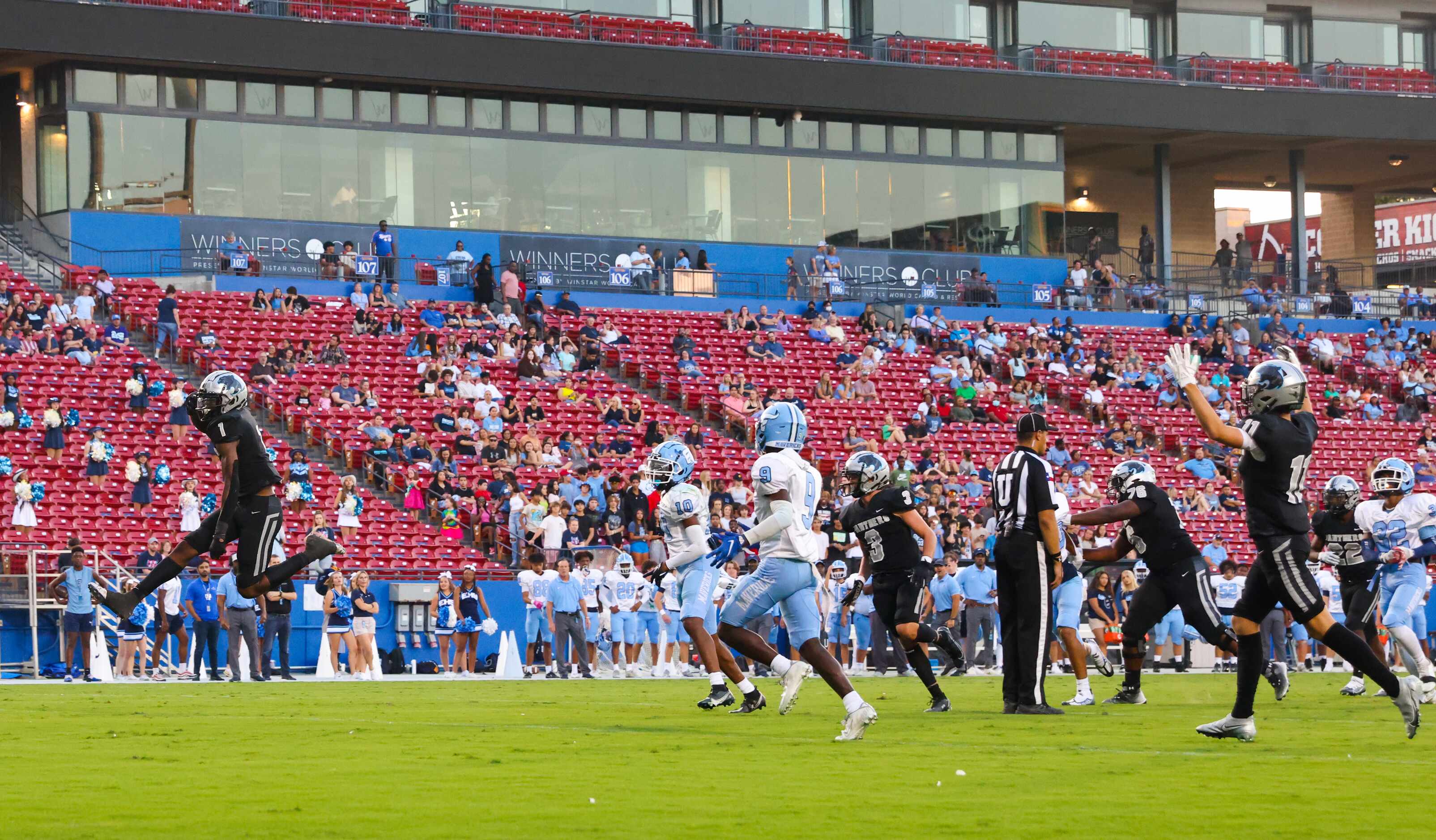 Panther Creek Panthers running back Sentel Simpson (1) leaps as he enters the end zone for a...