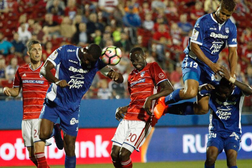 Deportivo Arabe Unidoâs Fidel Caesar (3) heads the ball in front of Roland Lamah (20) on a...