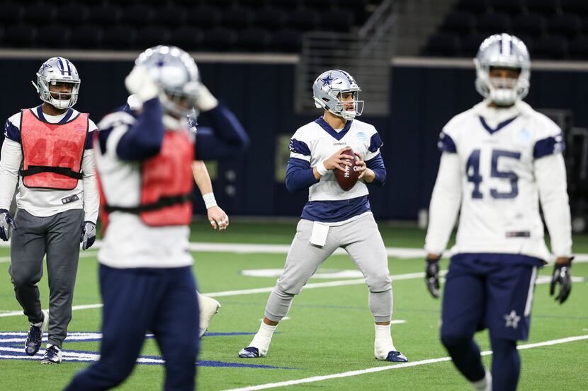 Dallas Cowboys quarterback Dak Prescott (4) looks to make a pass during a Cowboys practice...