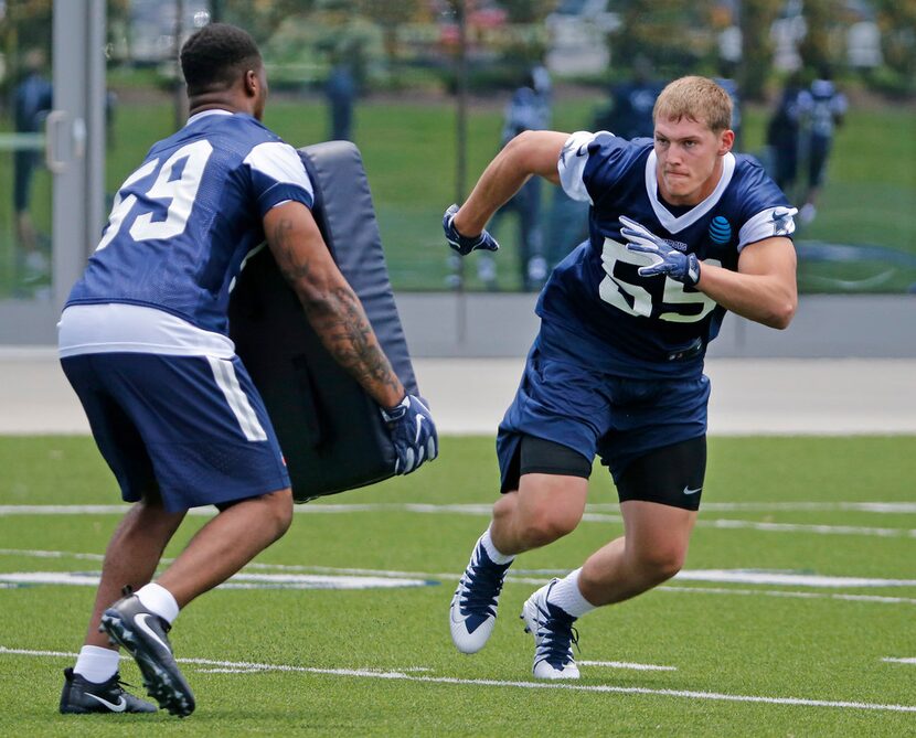 Dallas Cowboys linebackers  Chris Covingyon (59) Leighton Vander Esch (55) run through a...