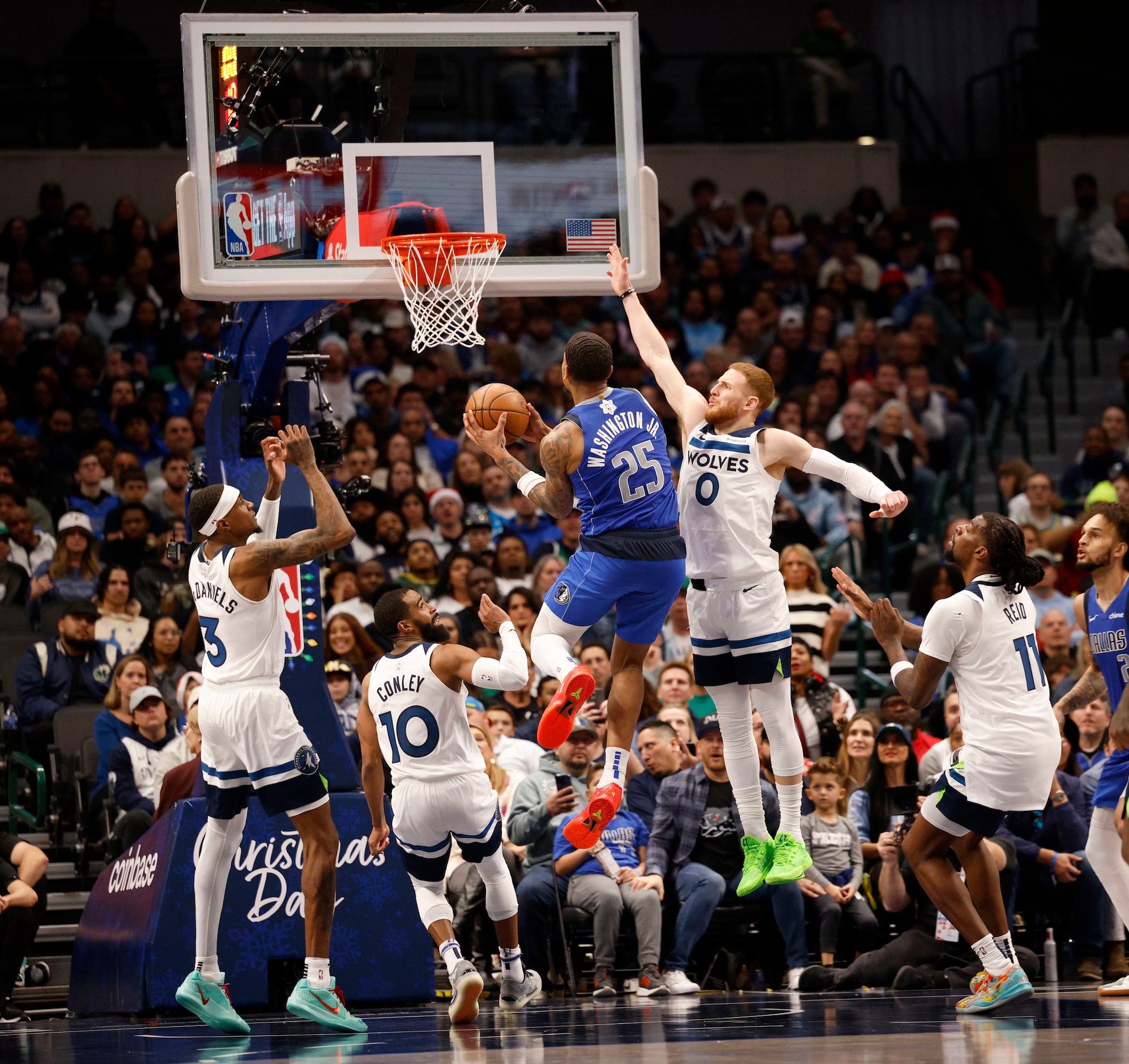 Dallas Mavericks forward P.J. Washington (25) attempts a jump shot as Minnesota Timberwolves...