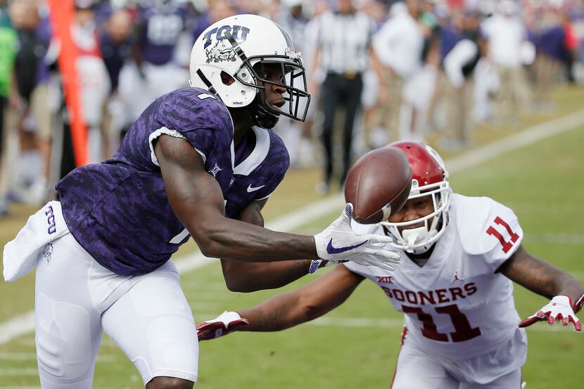 FILE - In this Oct. 20, 2018, file photo, TCU wide receiver Jalen Reagor (1) catches a pass...