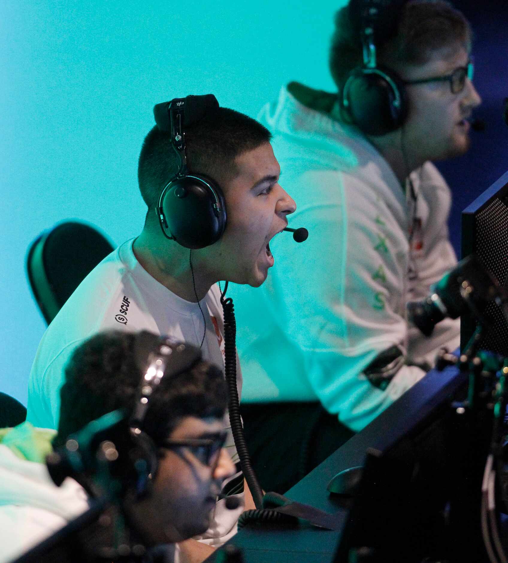 OpTic Texas player Anthony "Shotzzy" Cuevas, center, lets out a yell after making a big play...