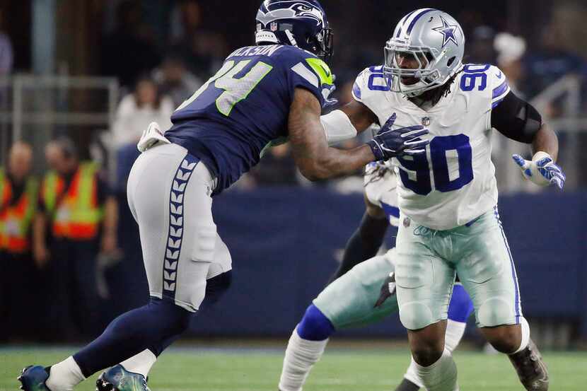 Dallas Cowboys defensive end Demarcus Lawrence (90) works against the Seattle Seahawks...