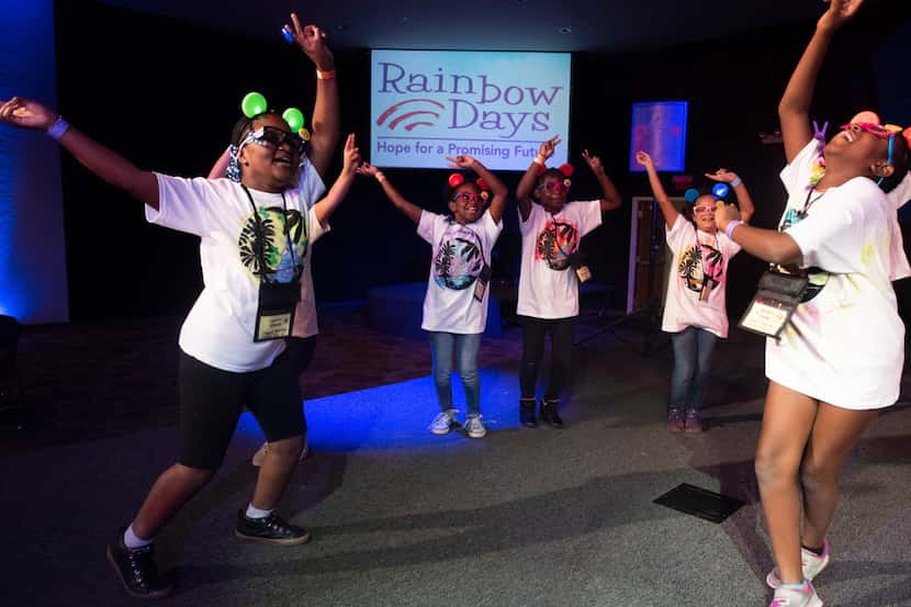 Children dance during Rainbow Days' Camp Bravo at Lovers Lane United Methodist Church on...