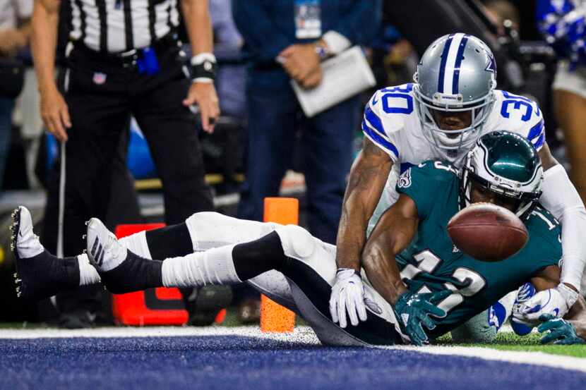 Dallas Cowboys cornerback Anthony Brown (30) tackles Philadelphia Eagles wide receiver...