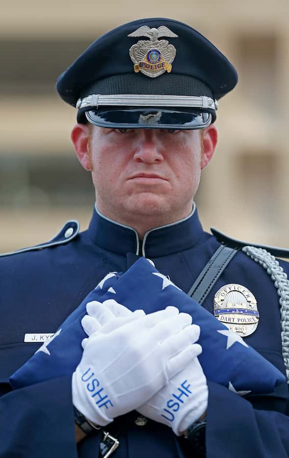 Joseph Kyser, a member of the DART Police Honor Guard (wearing official U.S. Honor Flag...