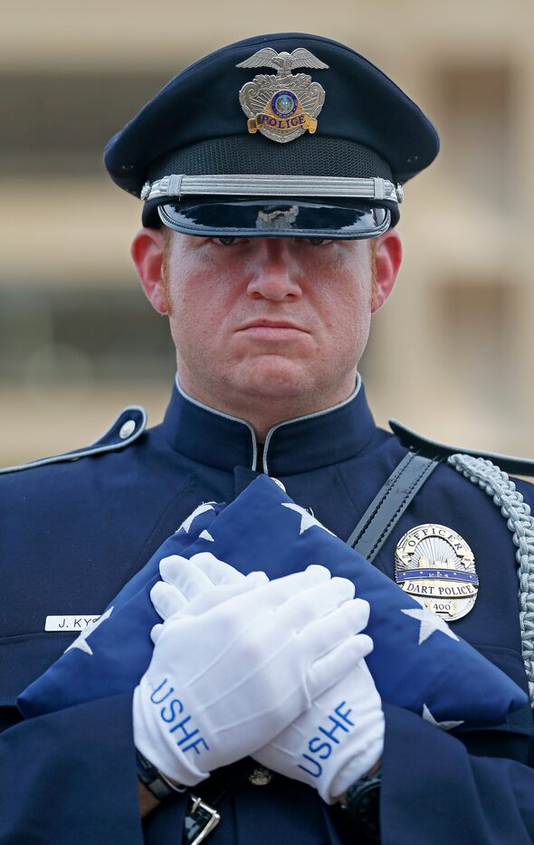 Joseph Kyser, a member of the DART Police Honor Guard (wearing official U.S. Honor Flag...