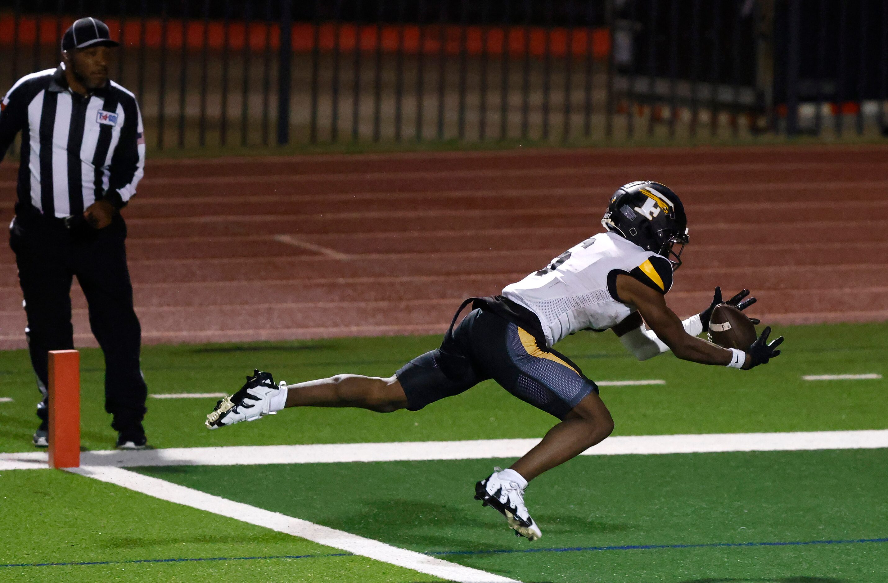 Forney wide receiver DJ Page (6) lays out for a long touchdown pass in the end zone against...