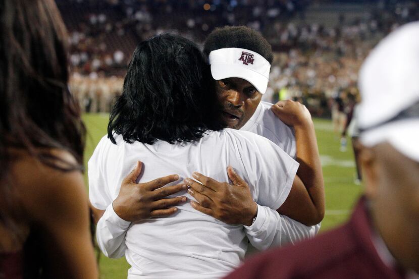 Texas A&M Aggies head coach Kevin Sumlin receives a hug from his daughter Courtney Sumlin...