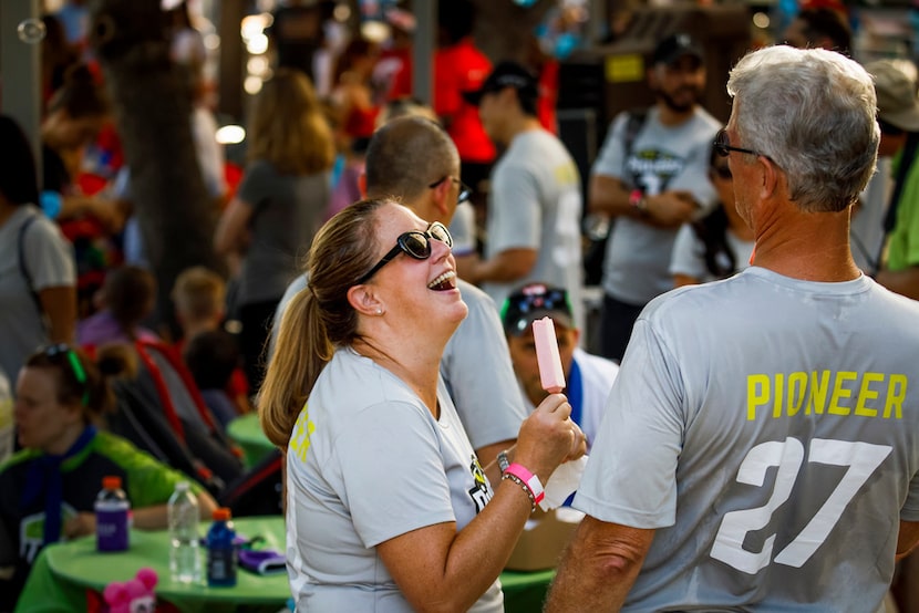 Pioneer Natural Resources team members Dennis Dronzek (right) and a smiling Shelly Ahlerich...