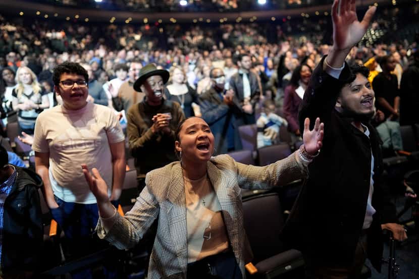 A woman sings during a service at Lakewood Church, Sunday, Feb. 18, 2024, in Houston. Pastor...