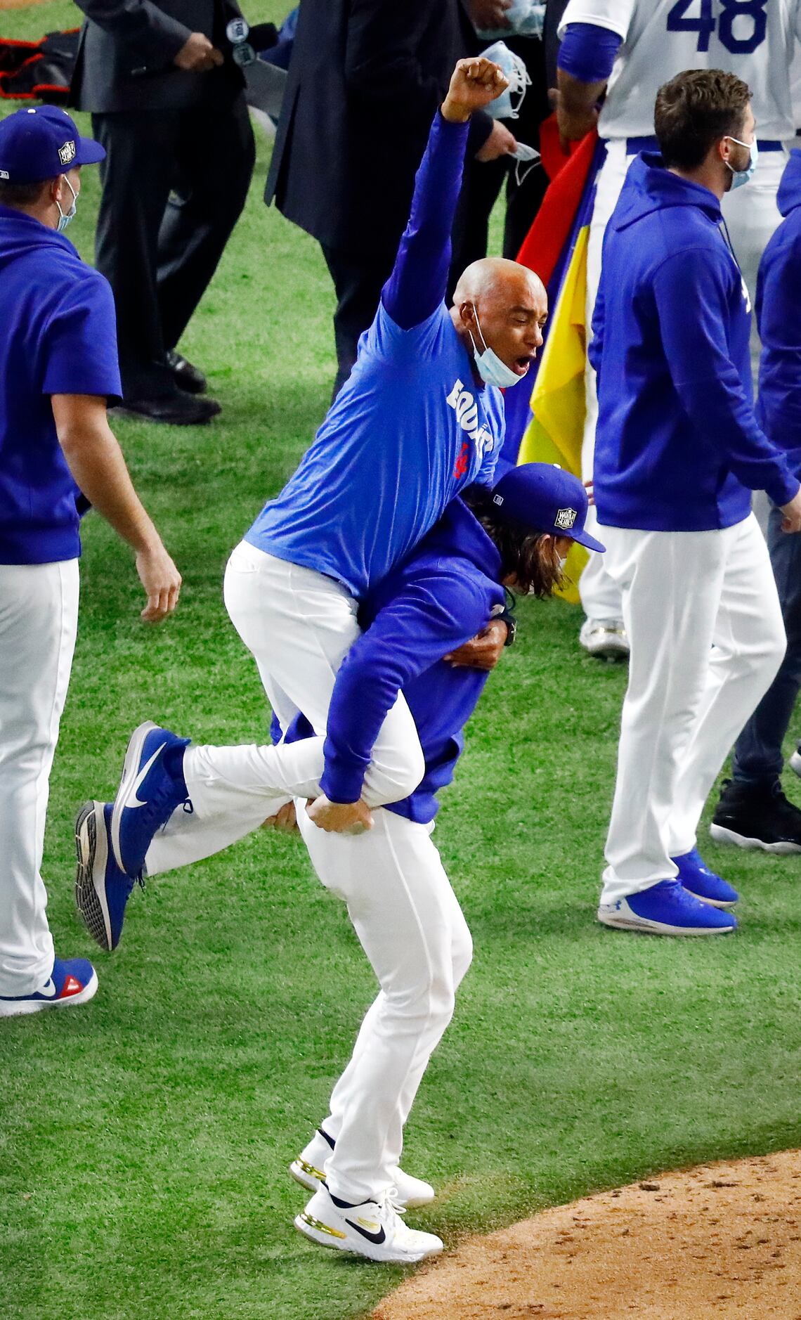 Los Angeles Dodgers players and coaches celebrate their World Series win over the Tampa Bay...