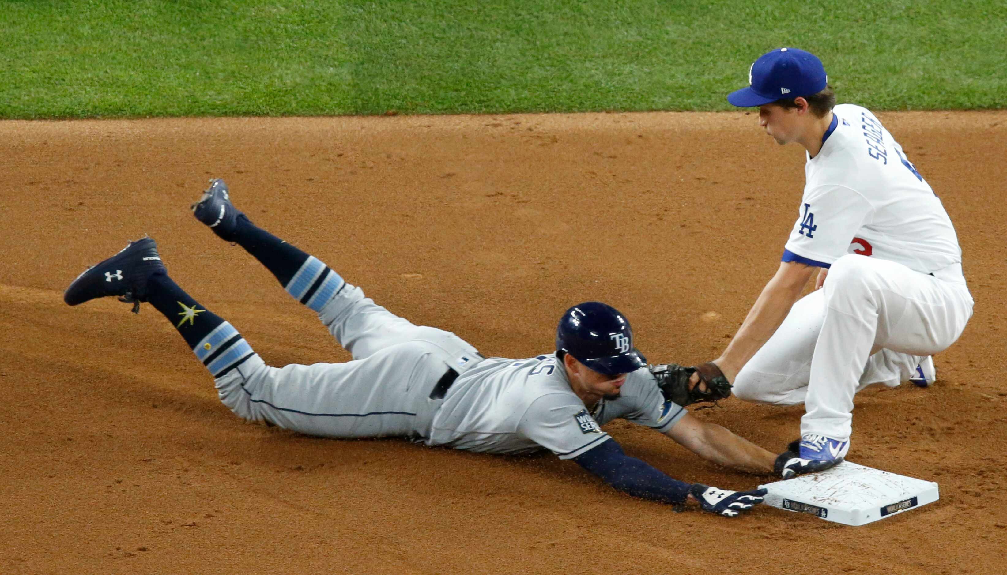 Los Angeles Dodgers shortstop Corey Seager (5) gets Tampa Bay Rays shortstop Willy Adames...