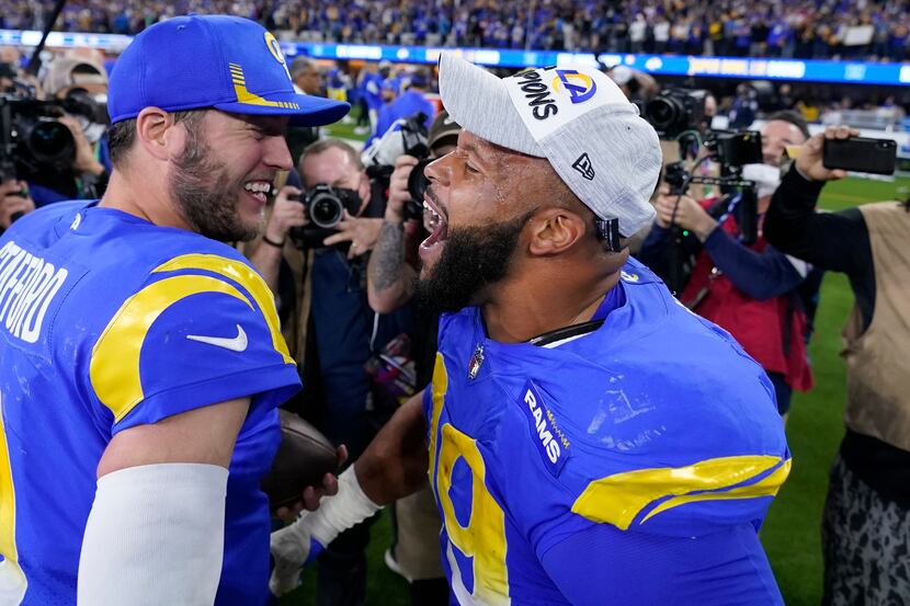 Los Angeles Rams' Matthew Stafford, left, and Aaron Donald celebrate after the NFC...
