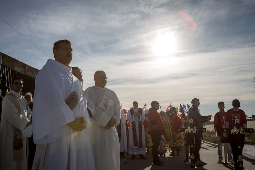 The procession for the Dia de los Muertos Mass on the Rio Grande in El Paso on Saturday,...