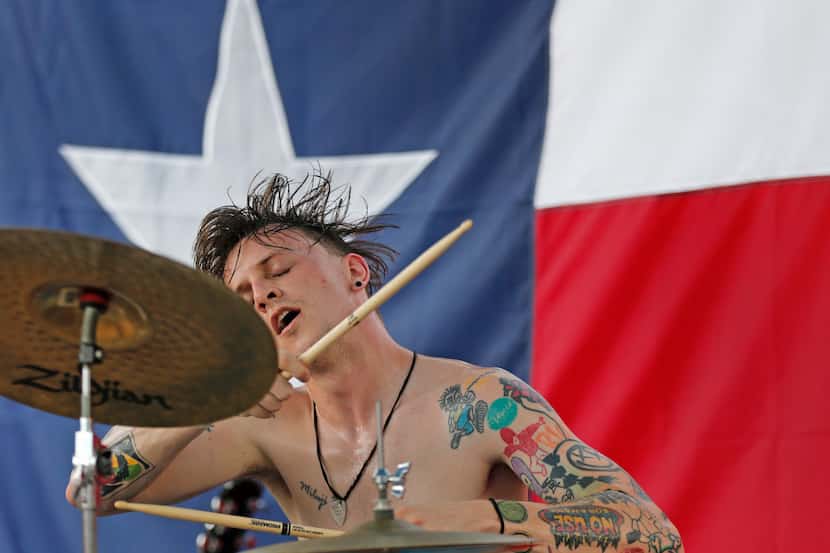 The drummer for The Butts performs as part of the Warped Tour at Dos Equis Pavilion in...