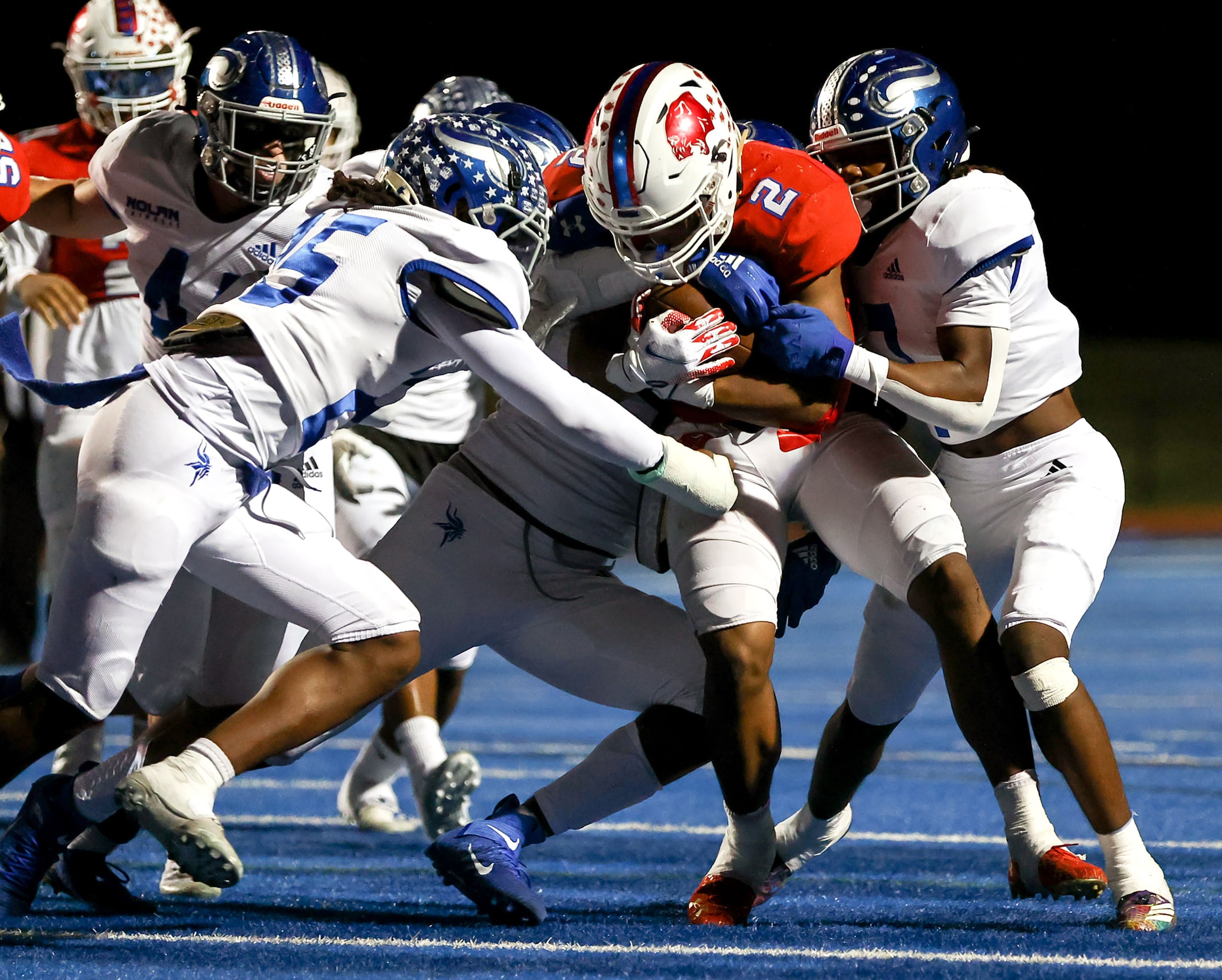 Parish running back Andrew Paul (2) fights for yardage against Nolan during the first half...