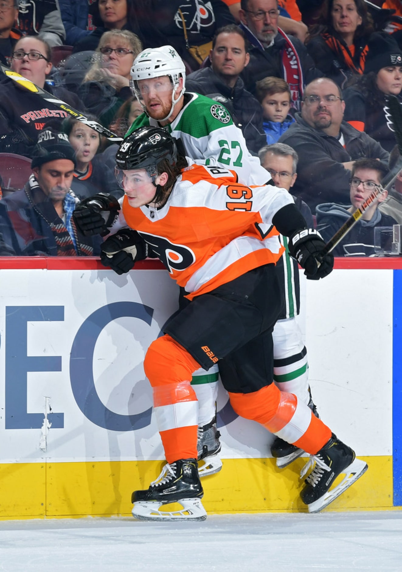 PHILADELPHIA, PENNSYLVANIA - JANUARY 10: Nolan Patrick #19 of the Philadelphia Flyers checks...