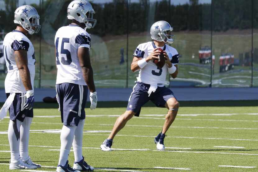 Dallas Cowboys quarterback Mark Sanchez (3) works out with teammates during practice at The...