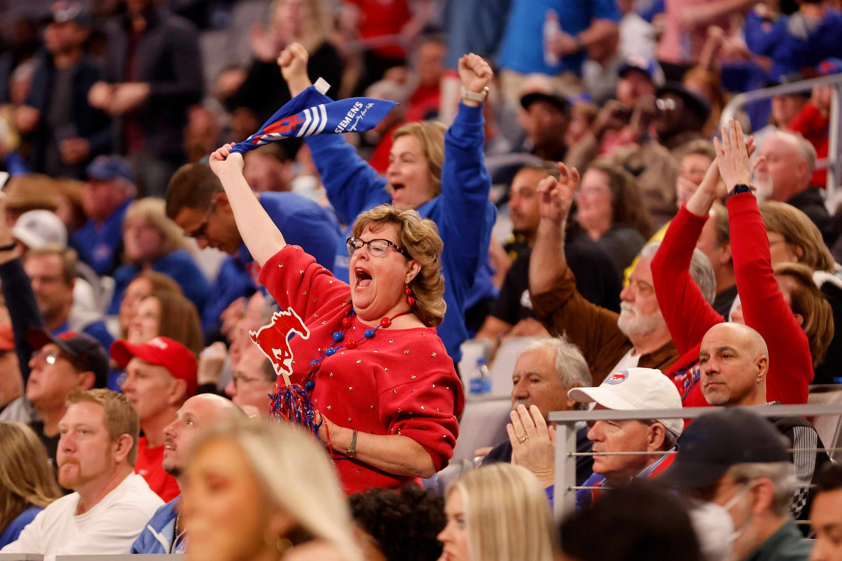 SMU fans cheer during the second half of the AAC men’s basketball tournament semifinal game...