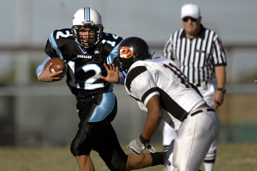 Sequin High quarterback Steven Pettis (No. 12) tries to elude Lancaster's John Miles (11)...