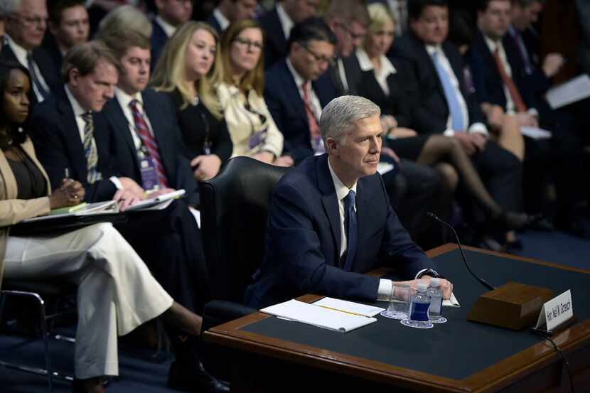 Neil Gorsuch listens during the Senate Judiciary Committee confirmation hearing as US...