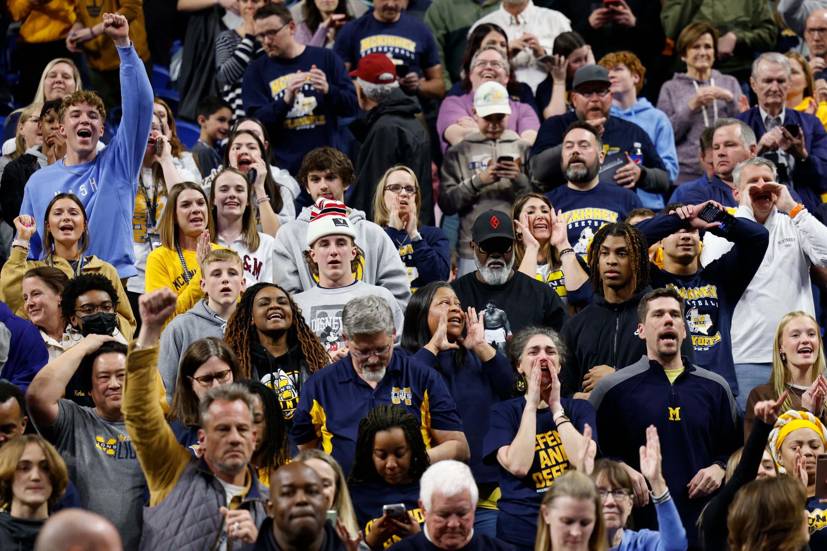 McKinney fans celebrate after winning a Class 6A state semifinal game against Austin...