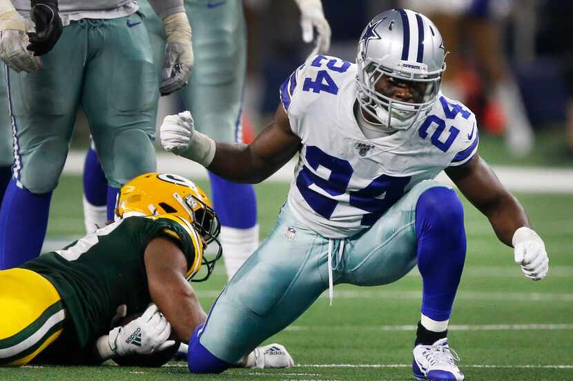 Dallas Cowboys cornerback Chidobe Awuzie (24) celebrates his tackle of Green Bay Packers...