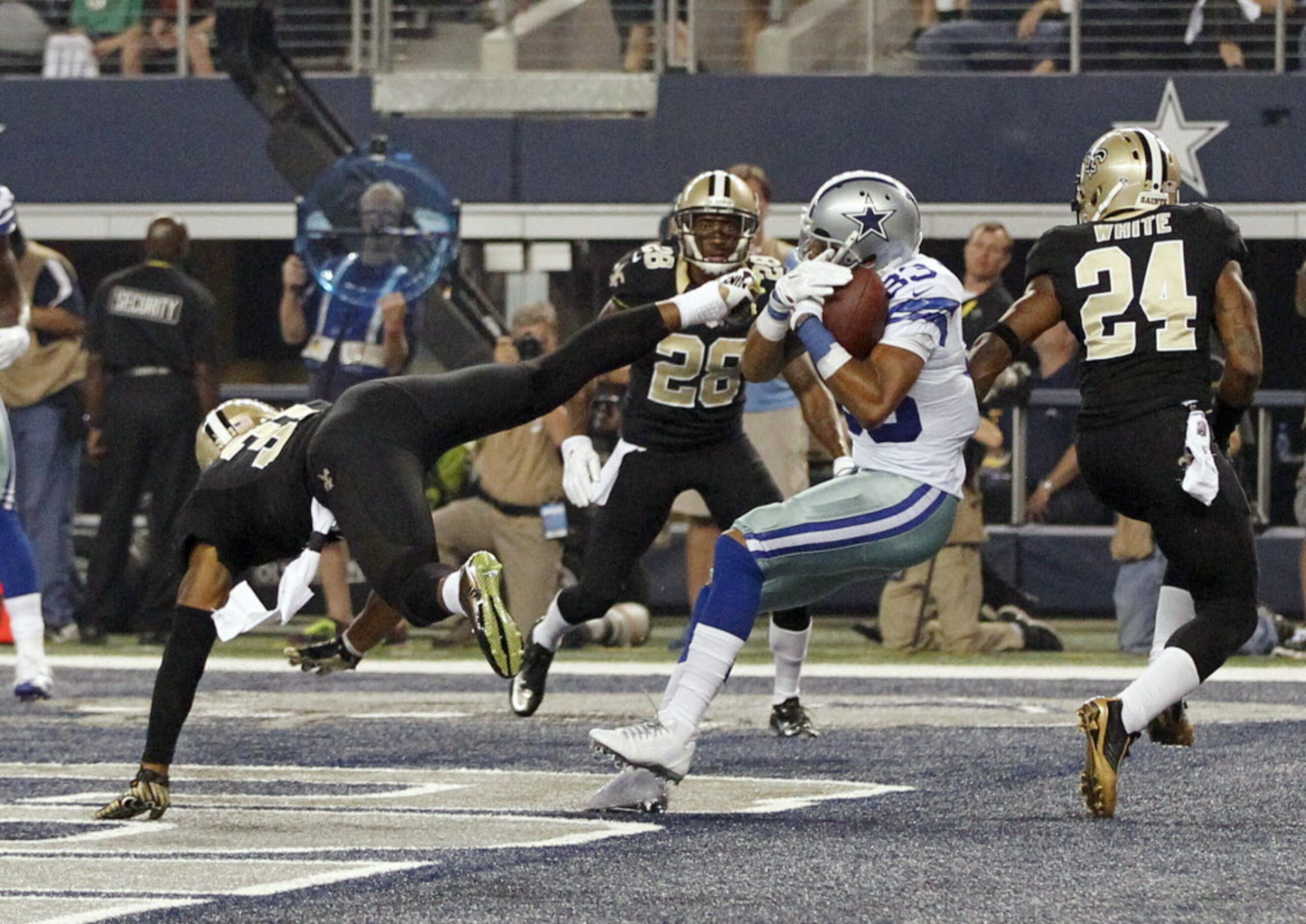 Dallas Cowboys wide receiver Terrance Williams (83) catches a pass for a touchdown between...