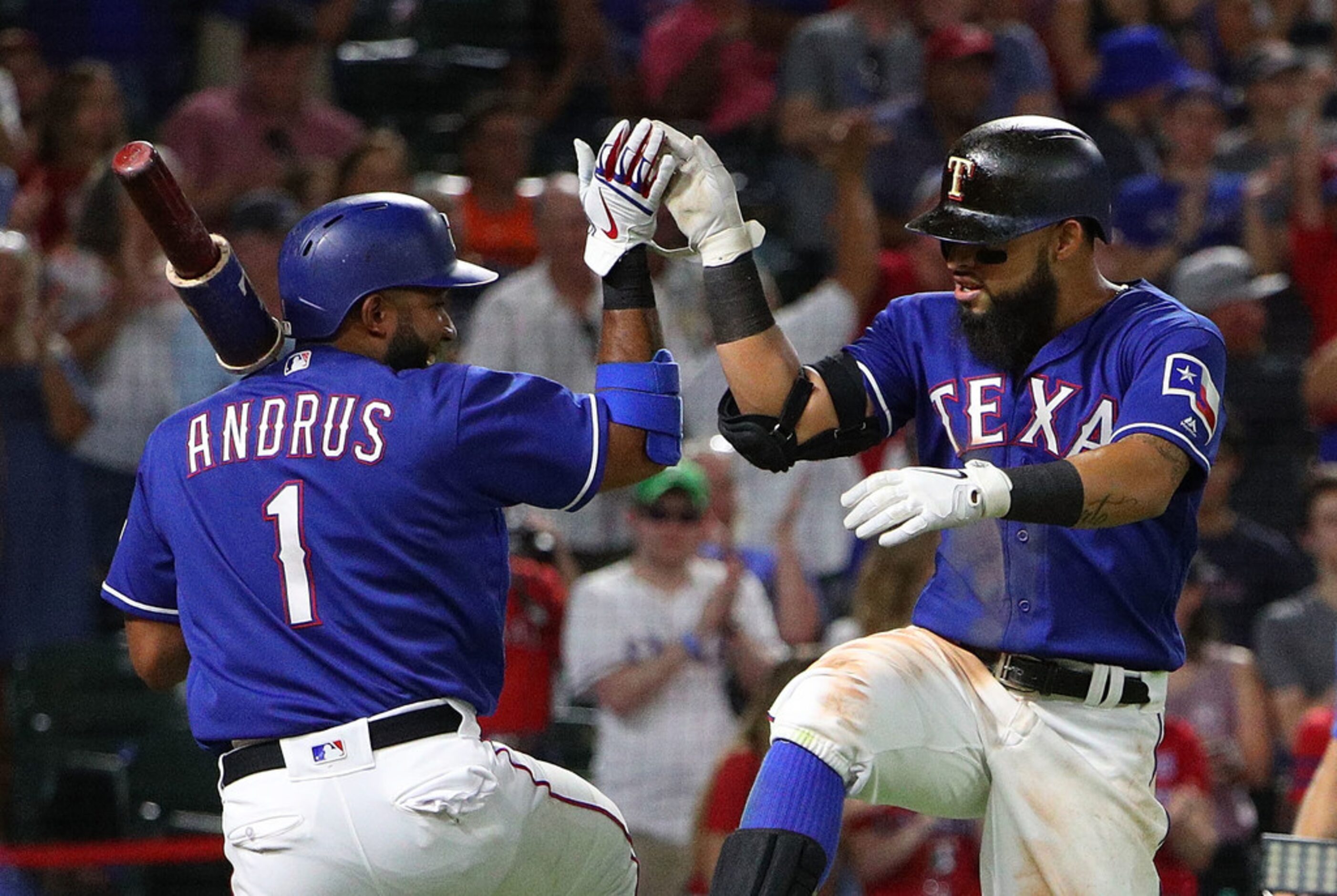 ARLINGTON, TX - AUGUST 04:  Elvis Andrus #1 of the Texas Rangers and Rougned Odor #12 of the...