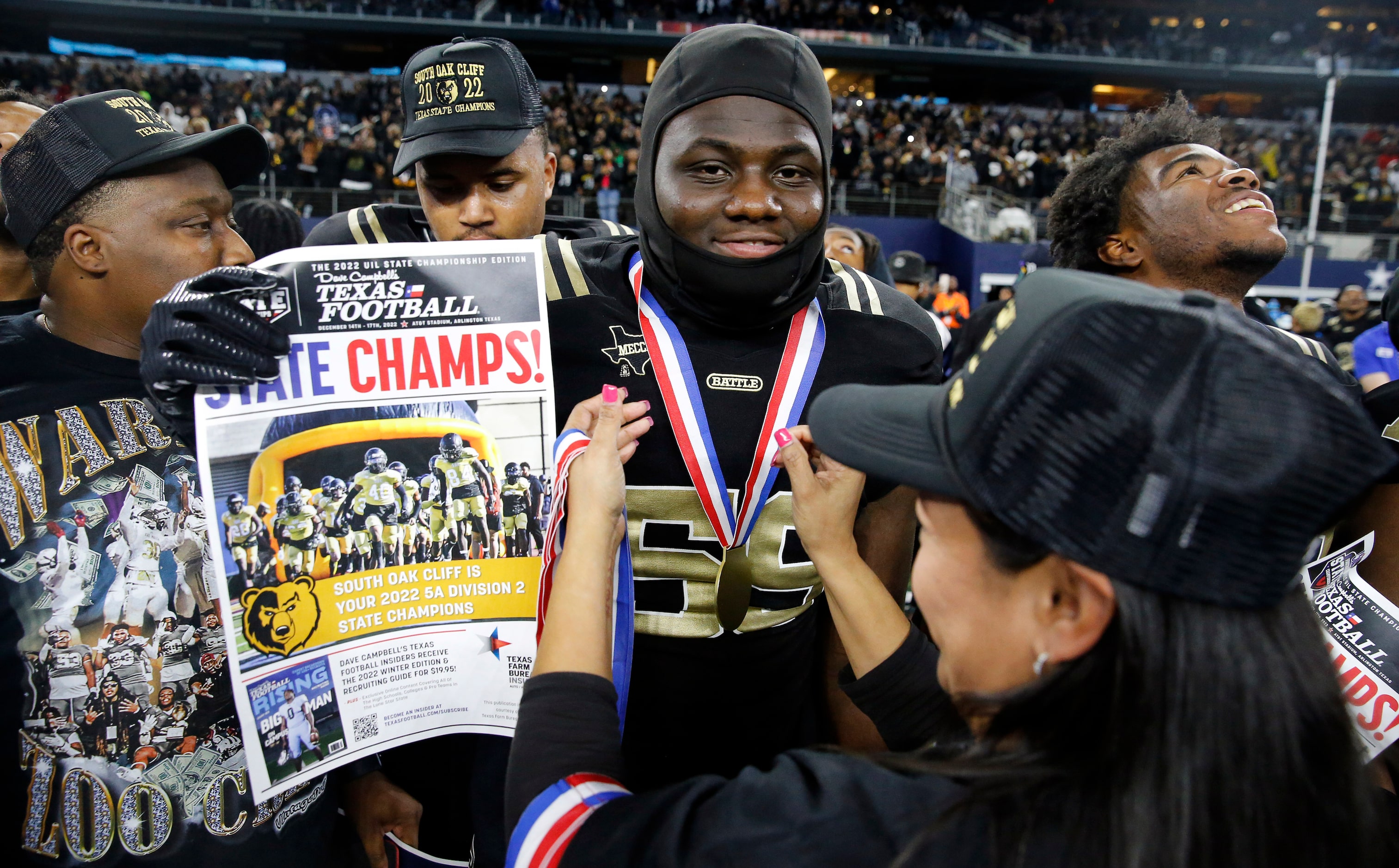 South Oak Cliff offensive lineman Kel Vohn Kendricks revives his medal as the team...