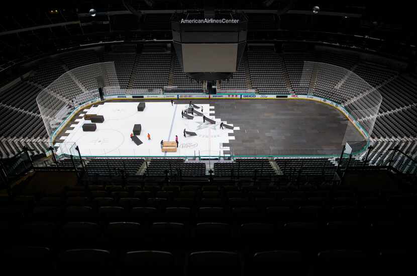Crews covered the hockey surface at American Airlines Center in March after the NHL put the...