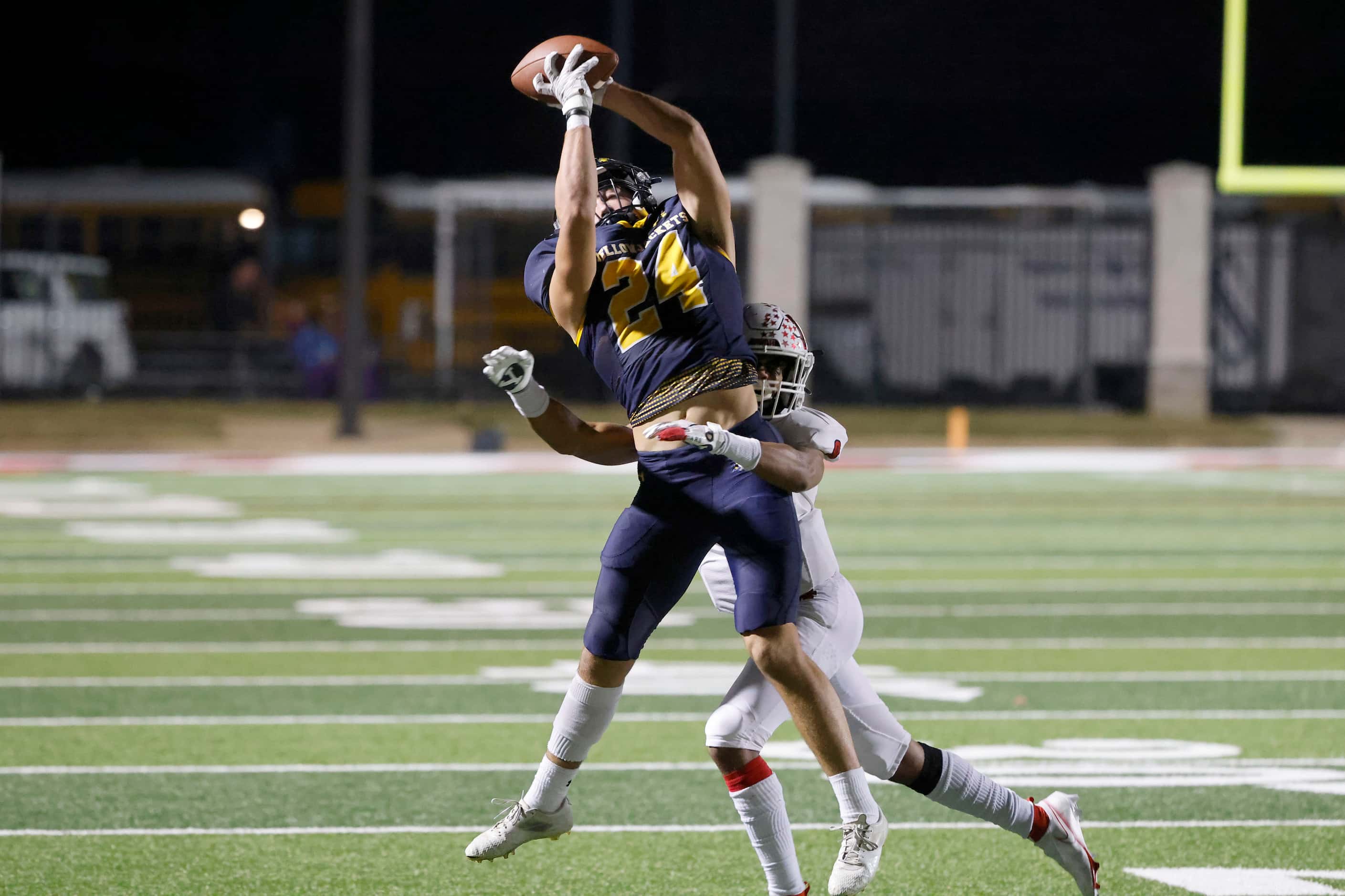 Stephenville’s Reece Elston (24) makes as first down catch in front of Melissa’s Jacob...